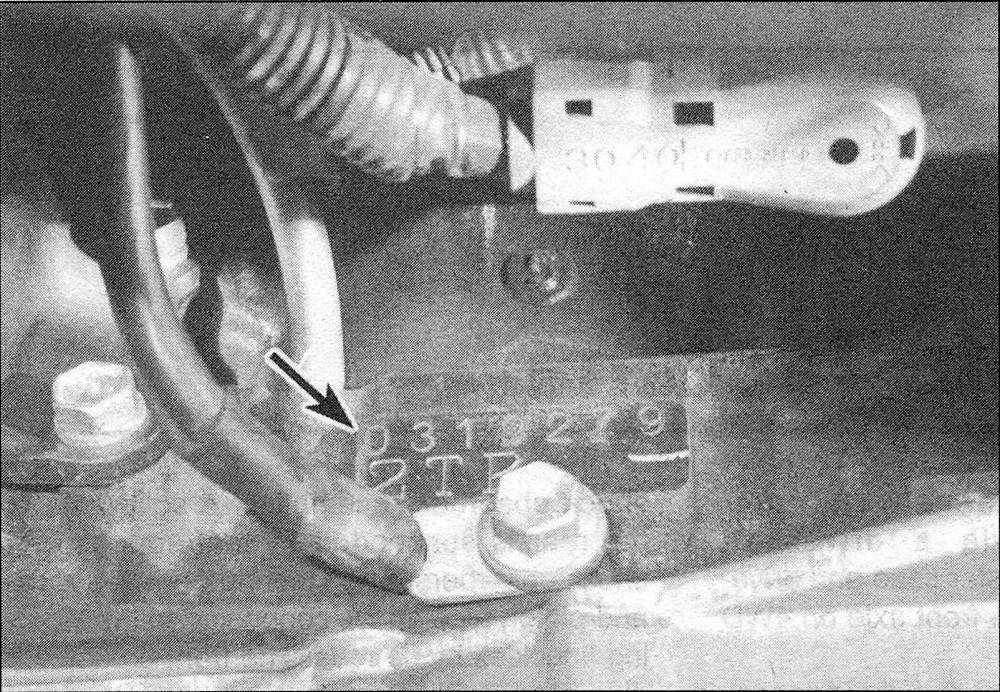 Toyota Tacoma The engine serial number on the four-cylinder engine is located at the left rear of the engine block, below the starter