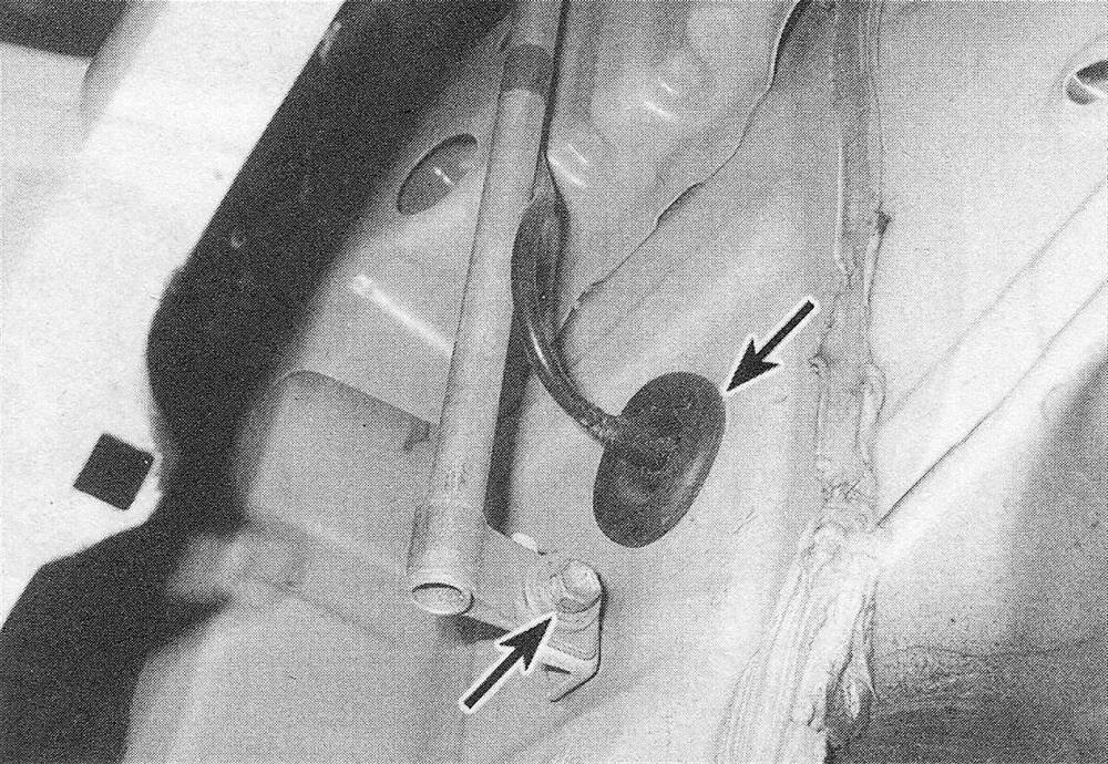 Toyota Tacoma Antenna - To detach the lower end of the antenna mounting base assembly , remove this bolt, then remove the weather grommet where the cable enters the cabin